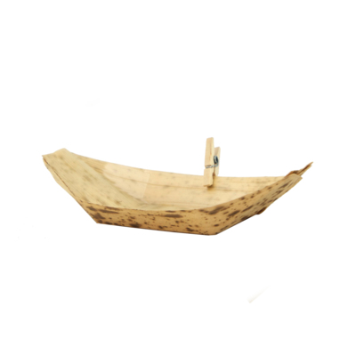 A bamboo leaf food boat with a mini clothespin clipped to the side