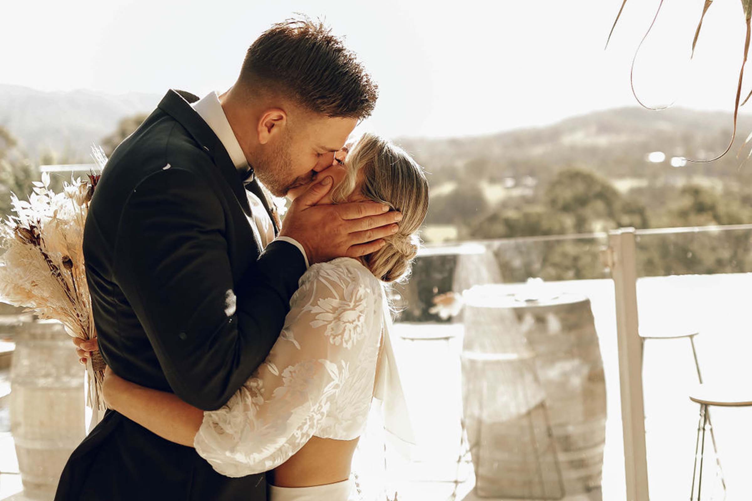 Bride and groom sharing a romantic kiss