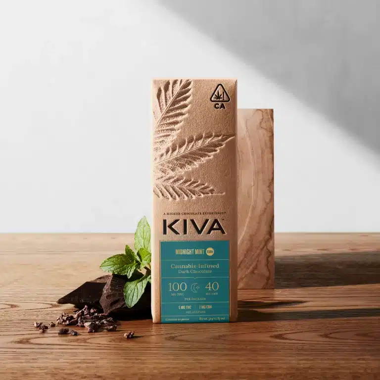 Kiva Confections Midnight Mint Dark Chocolate CBN packaging​ on a wooden table