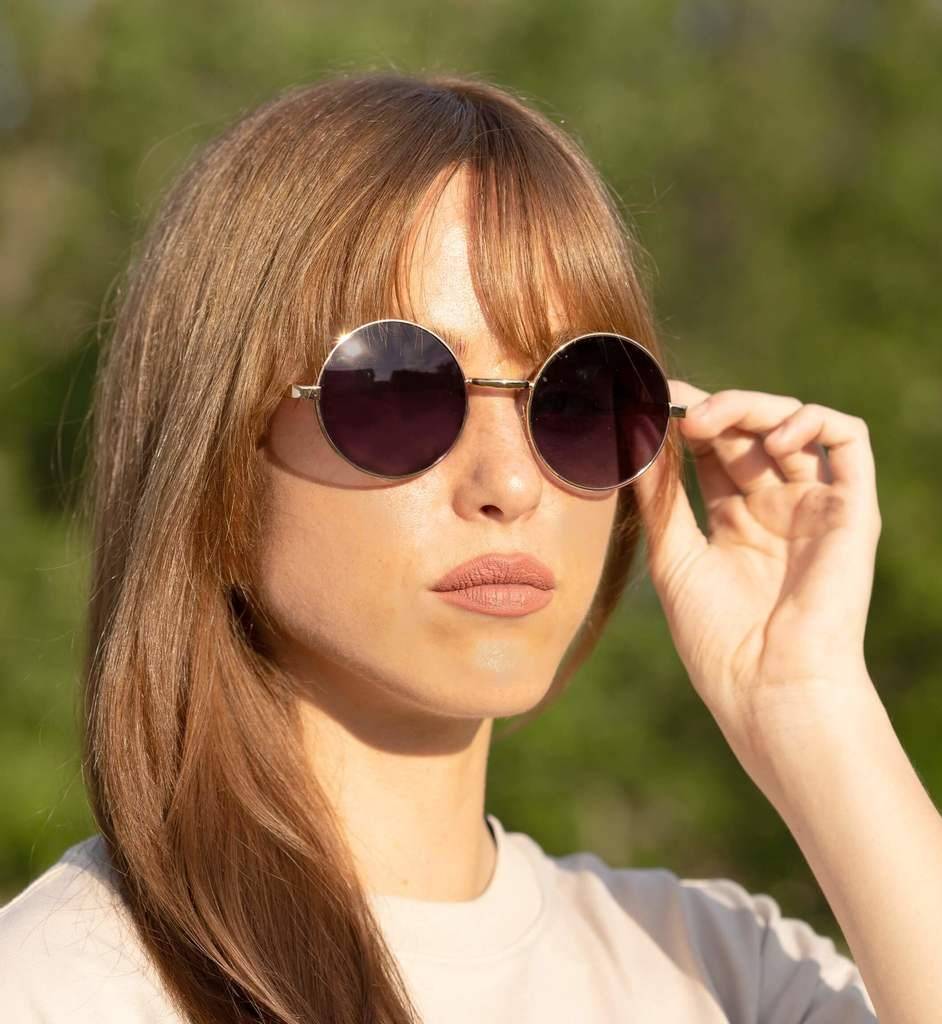 Woman wearing Lennon, John Lennon Polarized Sunglasses for Women