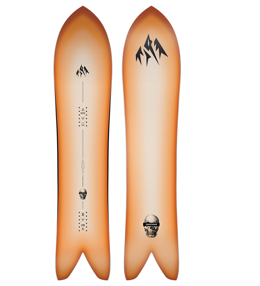 Two-sided snowboard with mountain designs and a skull logo.