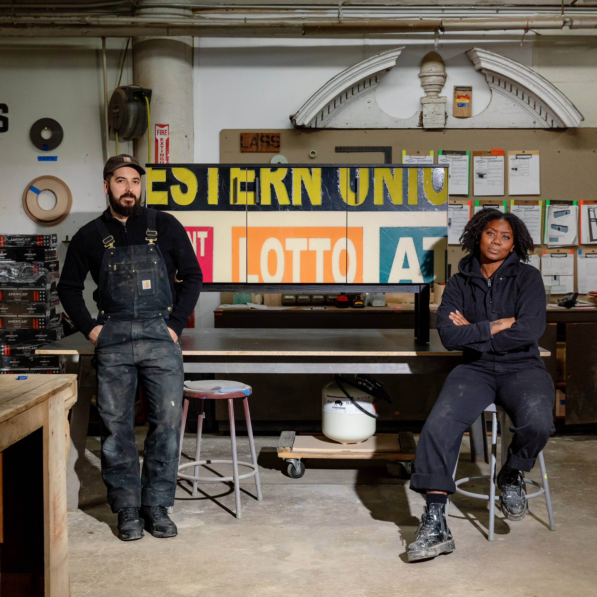 Owners of Woodward Throwbacks, Kyle and Bo as they sit in their woodshop in Hamtramck
