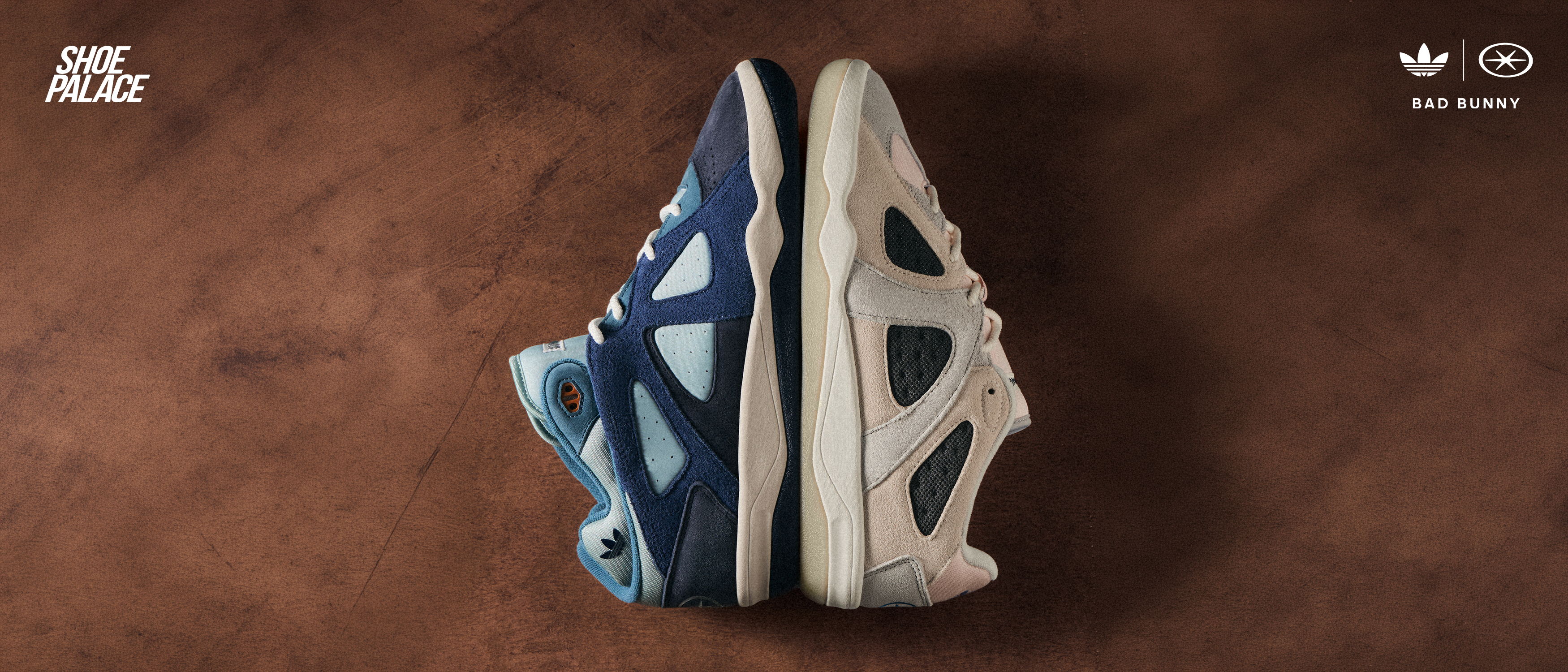 Two pairs of sneakers side by side on a brown surface.