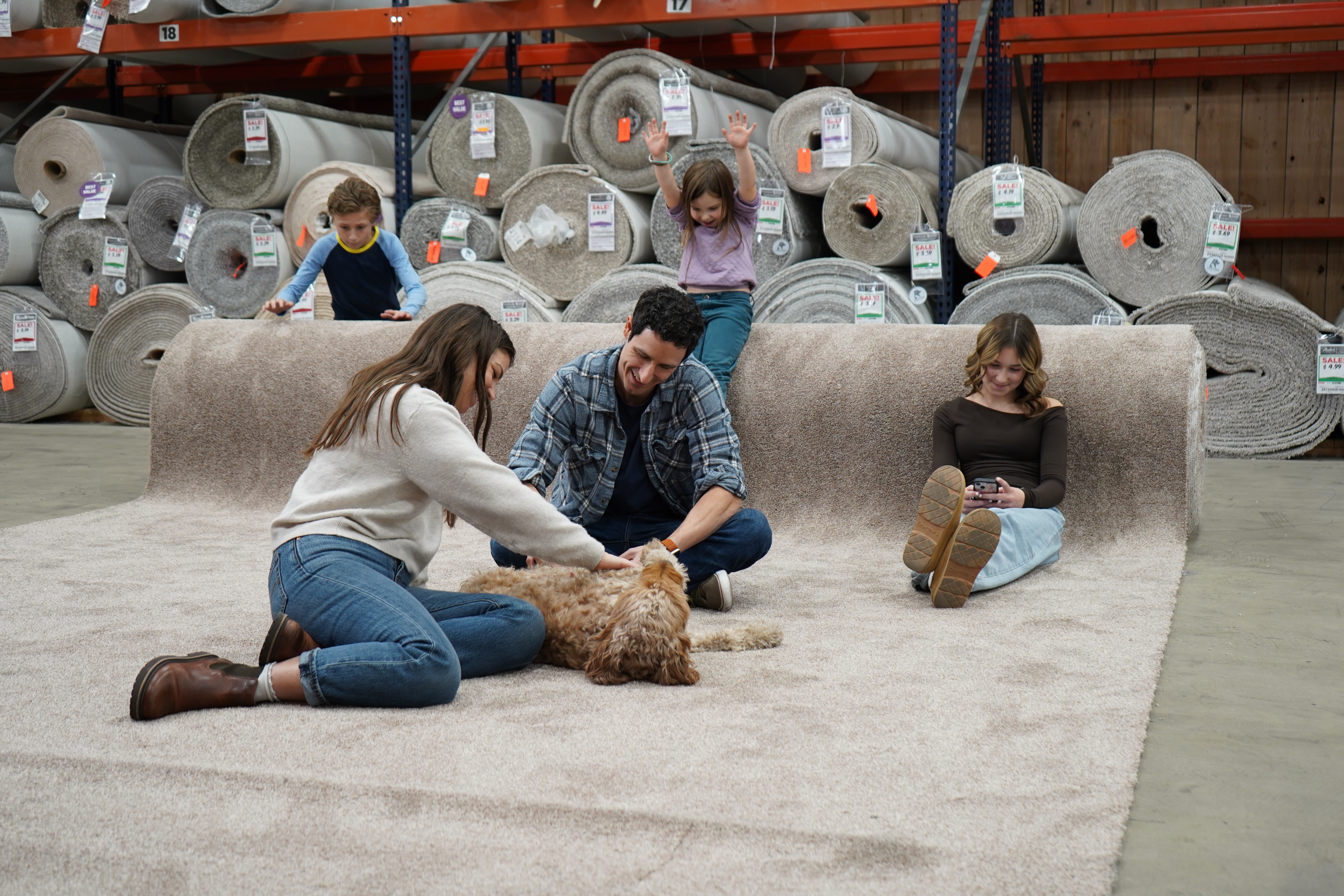 family testing carpet options at Carpet & Tile Mart