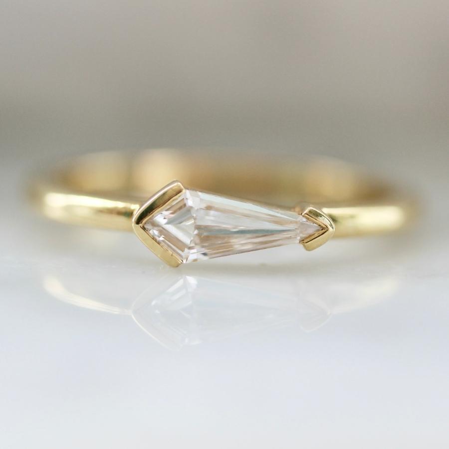 Kite cut diamond in half east west half bezel setting