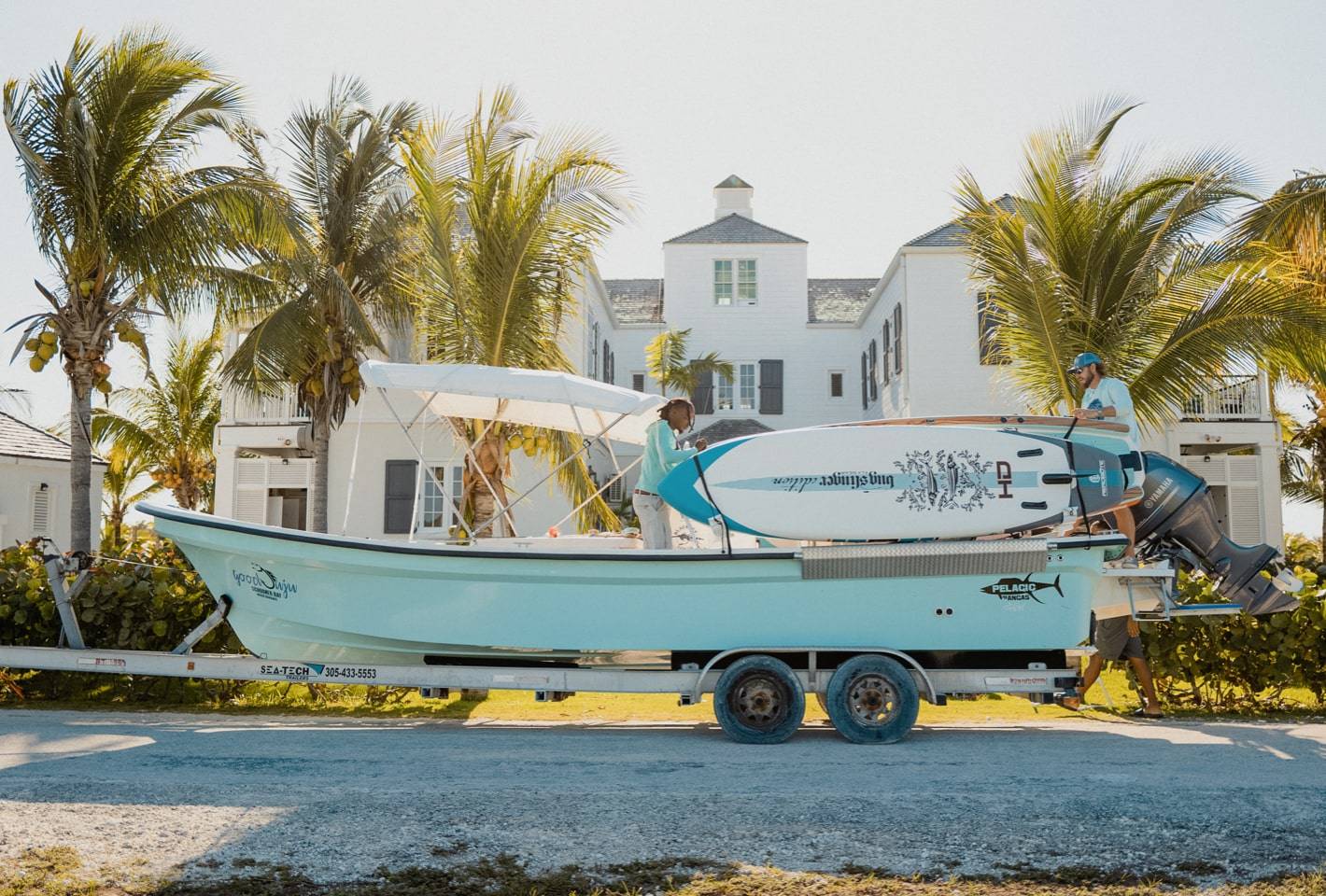 Loading the HD Paddle Board onto a boat in the Bahamas