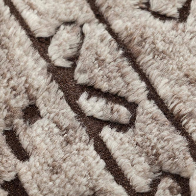 Textured fabric with a geometric pattern in beige and brown tones.