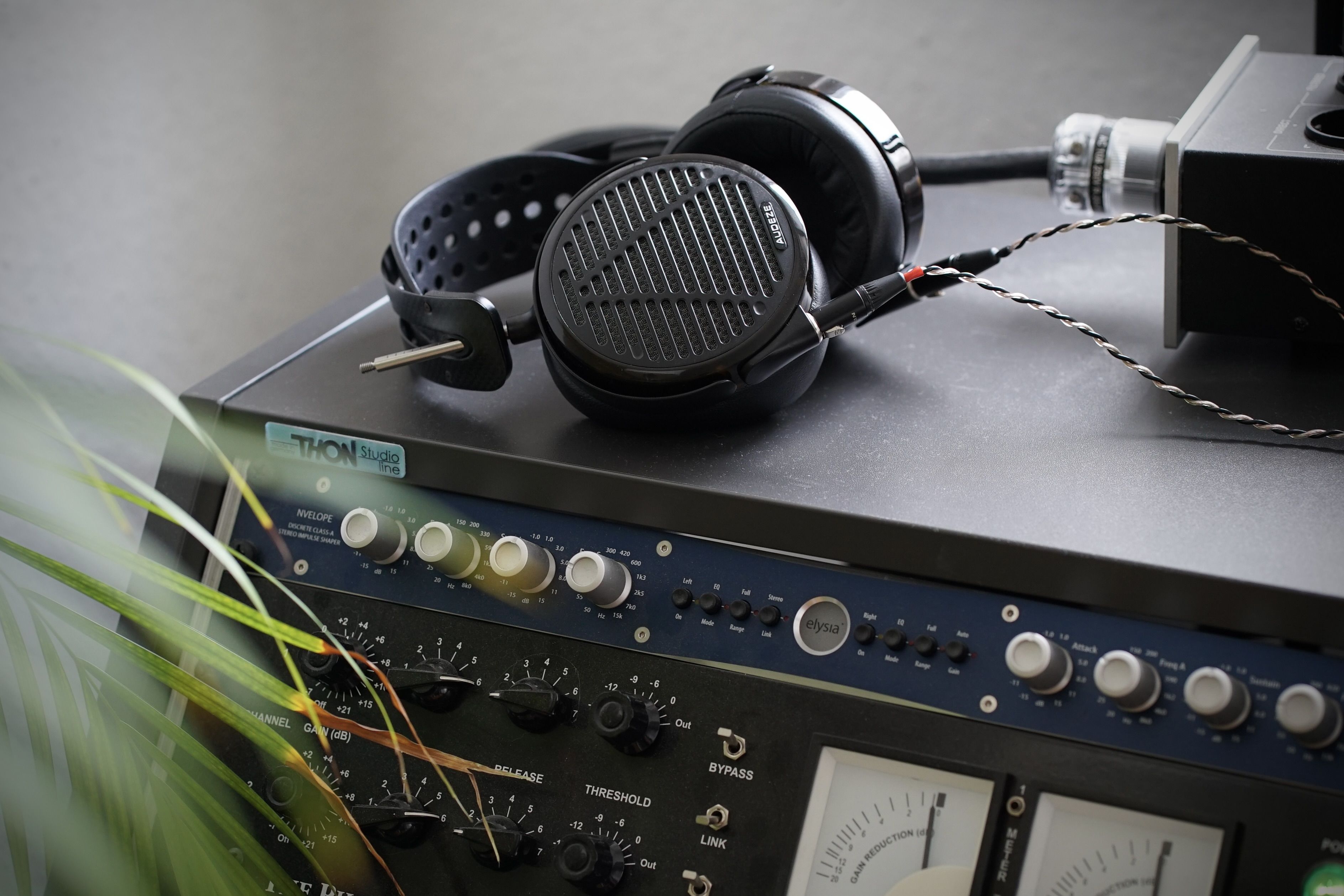 Audeze LCD-5 headphone laying on top of mixing equipment 