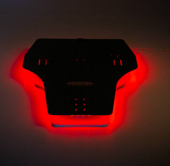 Velocity Rocker with glow of red LED lights.