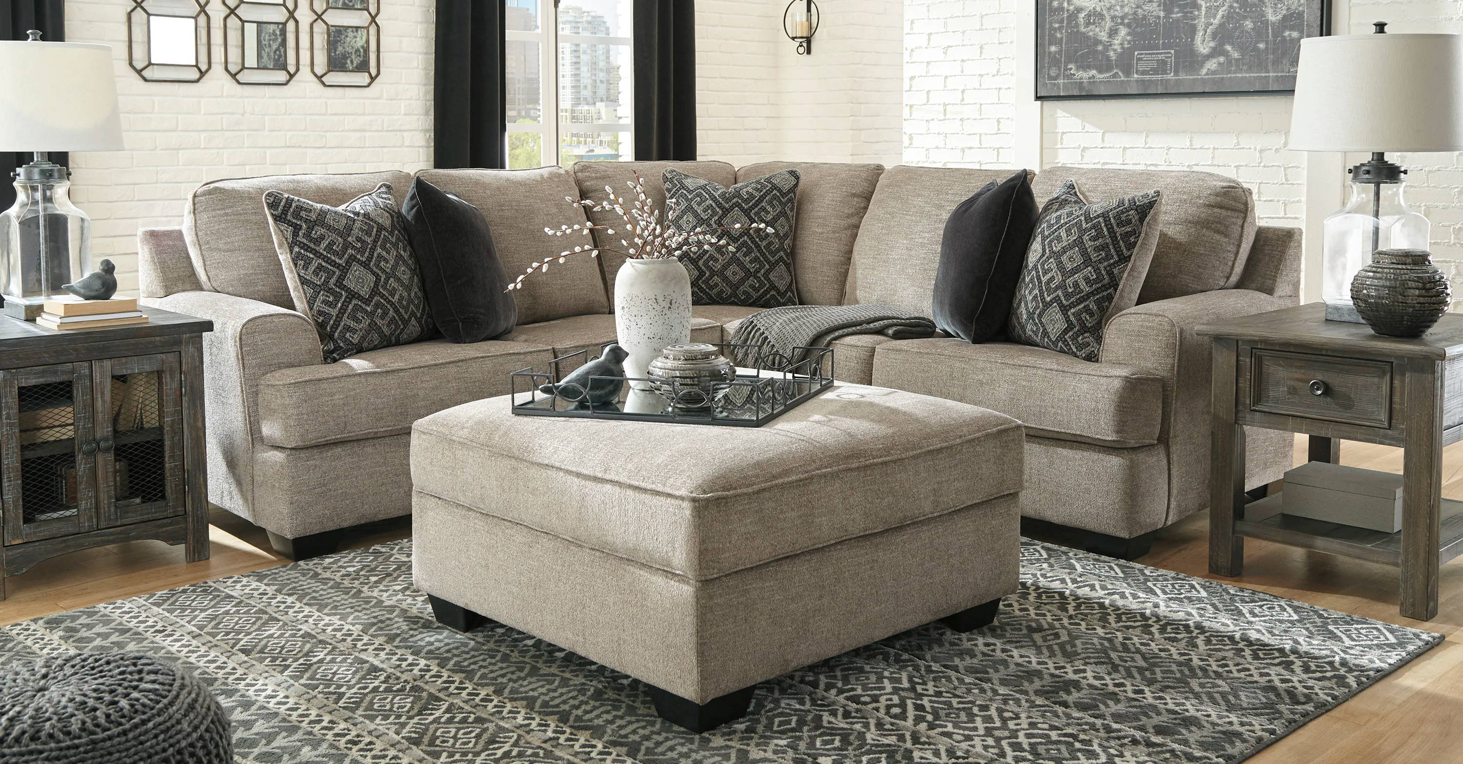 Cozy living room with sectional sofa, decorative pillows, and coffee table.