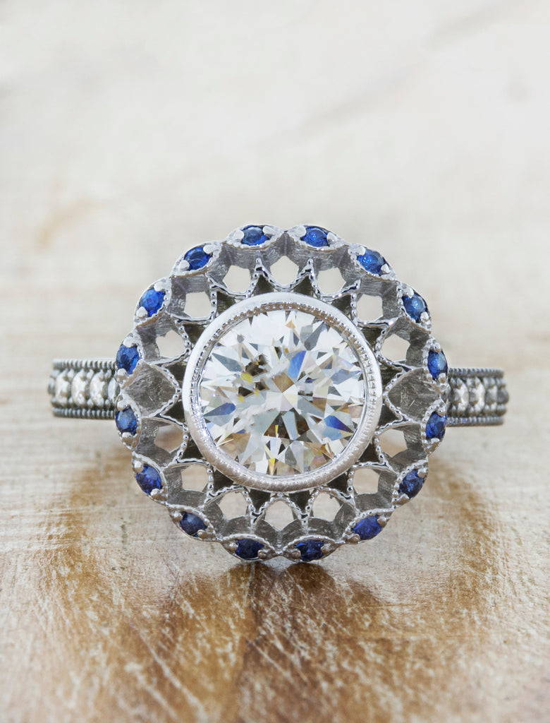 art deco inspired diamond and sapphire halo ring