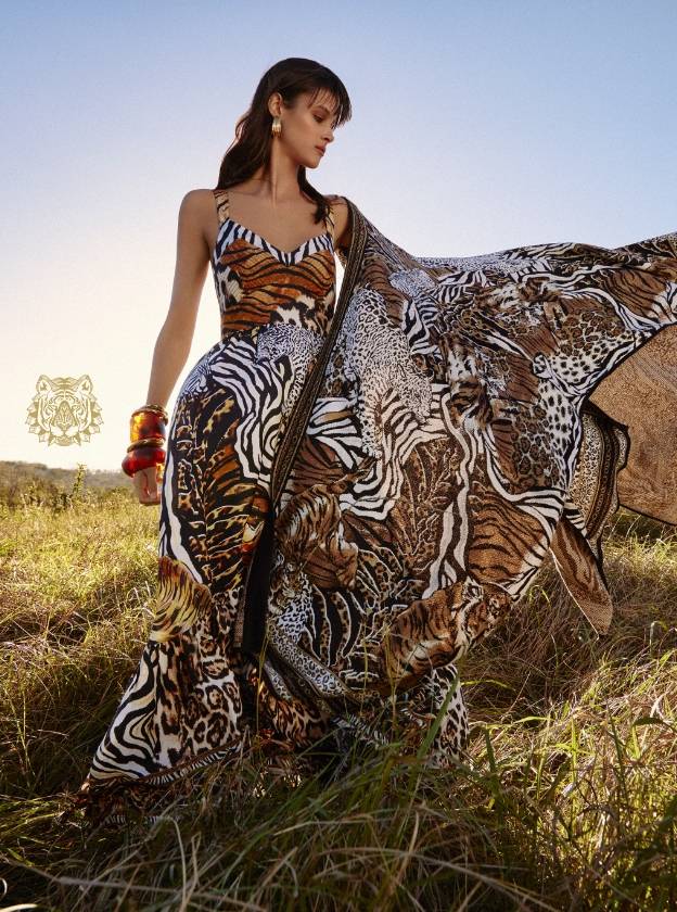 CAMILLA model wearing What's New Pussycat printed outfit standing in grass field