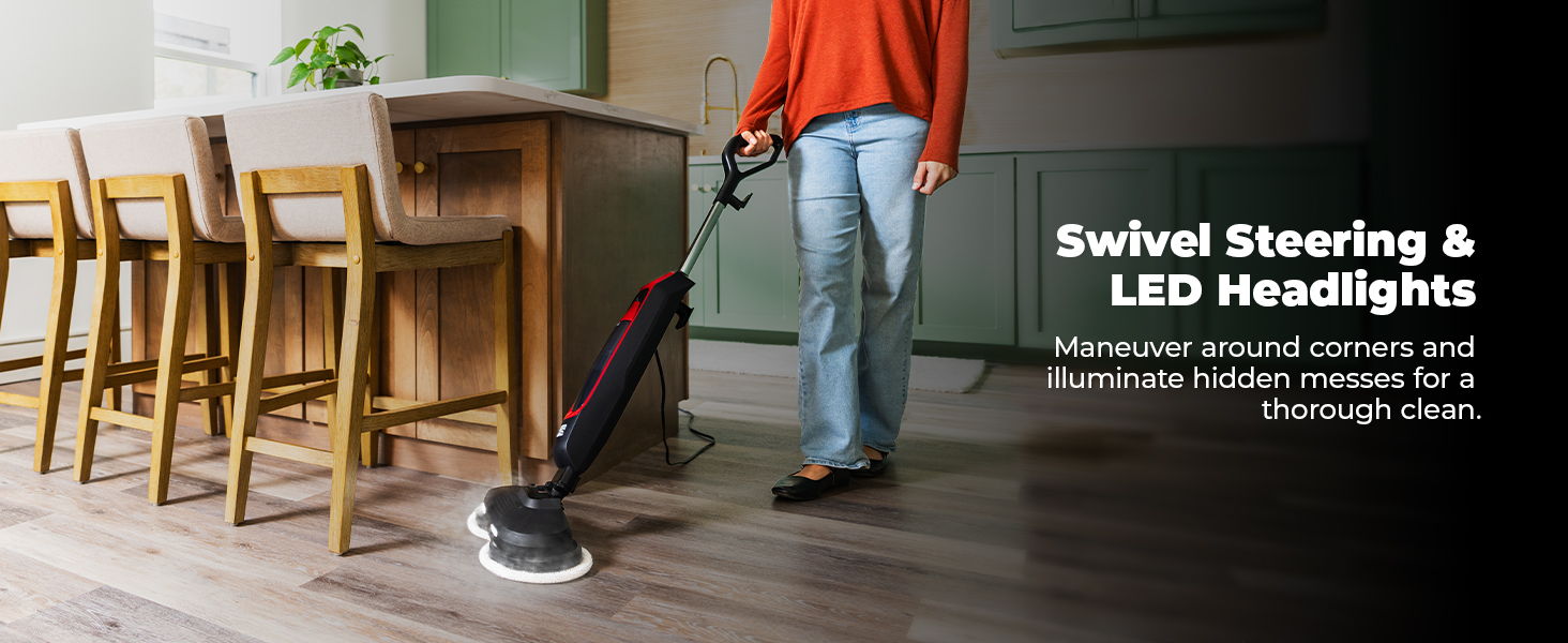 Person using a steam mop with swivel steering and LED headlights in a kitchen.