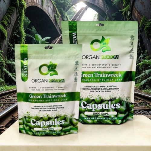Two packages of green training rock capsules on a natural background.
