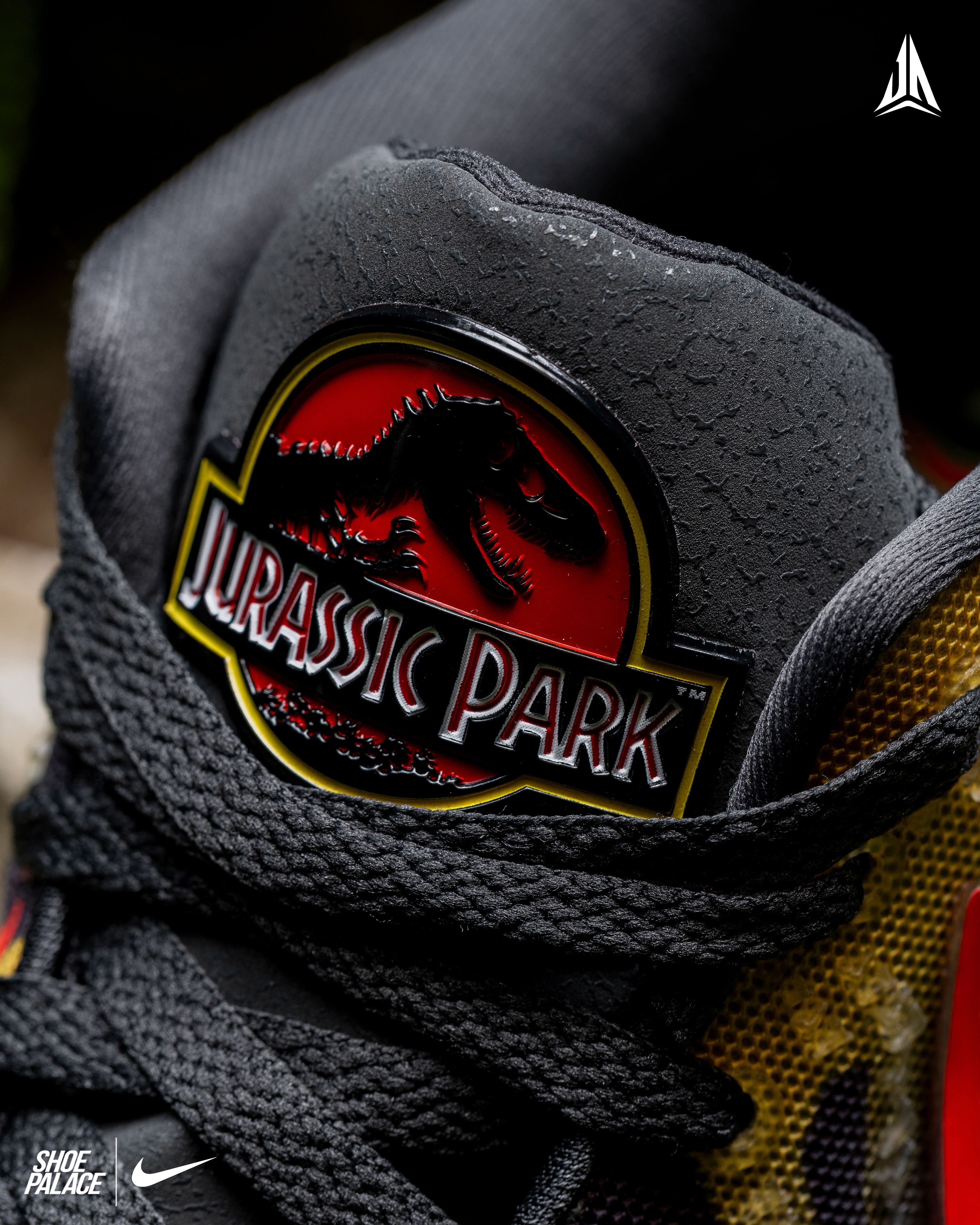 Close-up of a sneaker featuring a Jurassic Park logo.