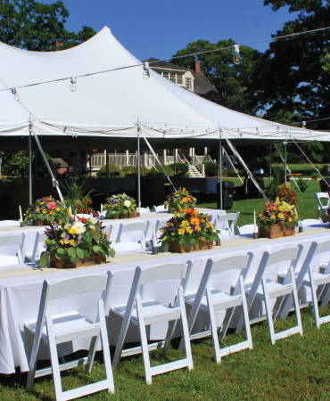 Party Tent Event with Tables and Chairs