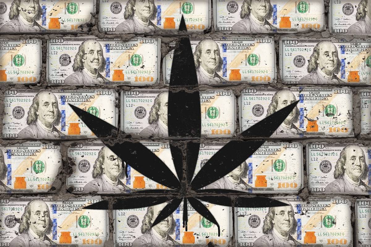 Marijuana symbol on top of piles of cash