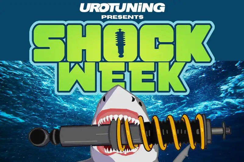 UroTuning shock week blog header shark holding coilover