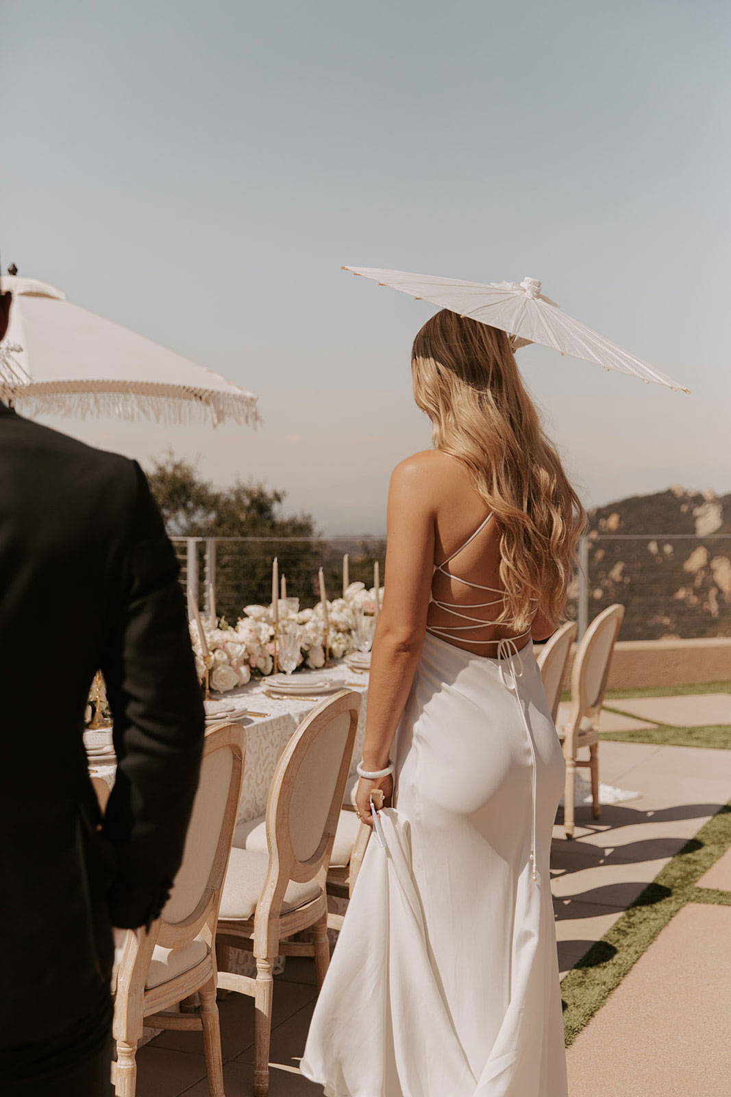 Bride with sun umbrella