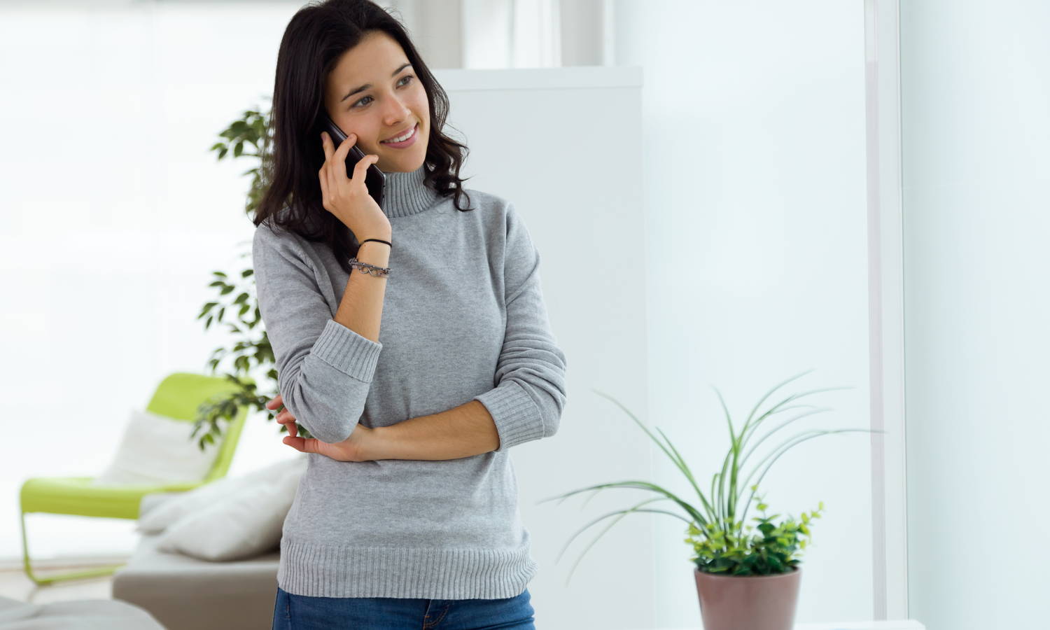 lady wearing a turtleneck sweater talking on the phone