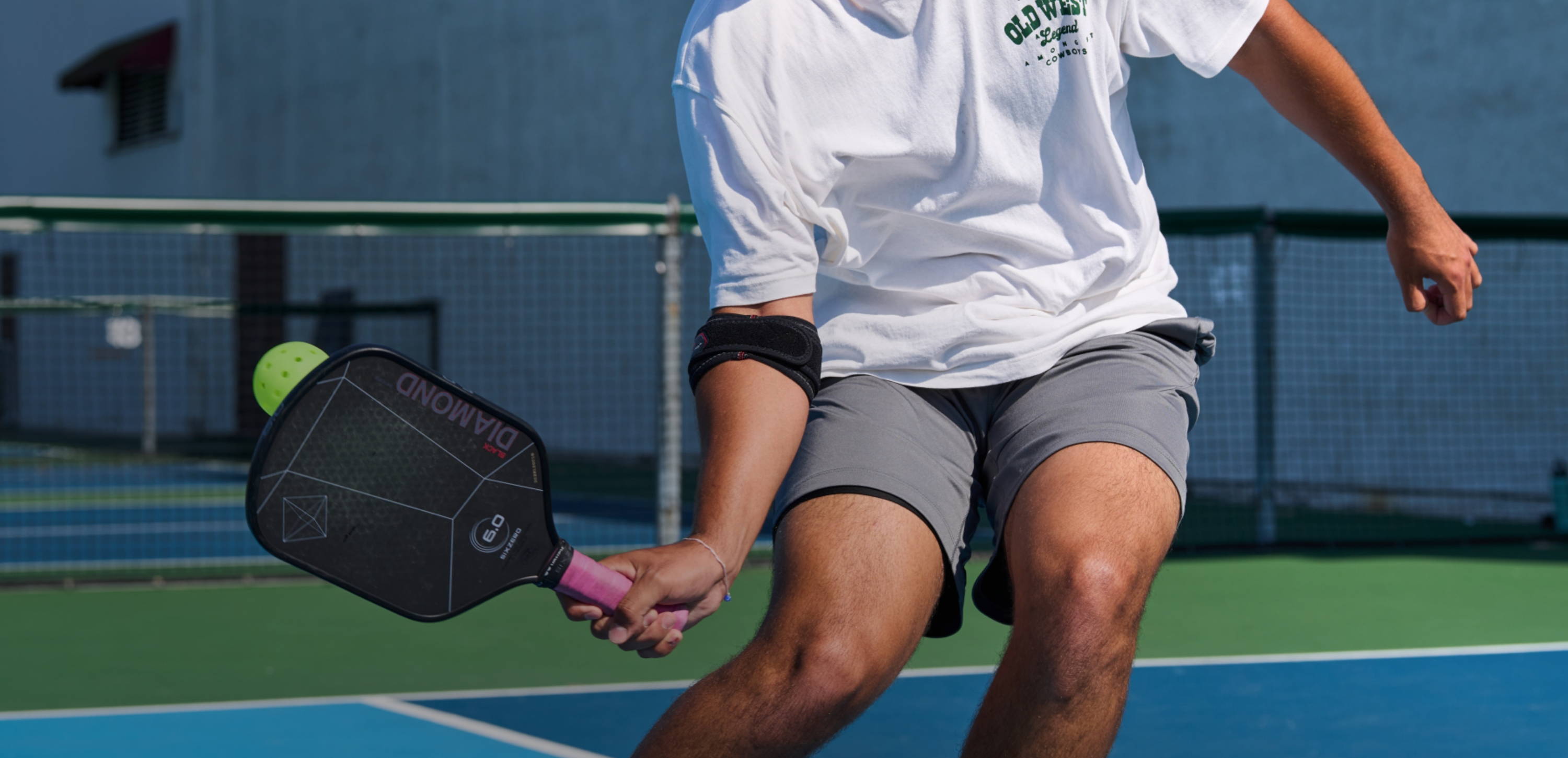 Pickleball Athlete Wearing McDavid Elbow Strap With Pads