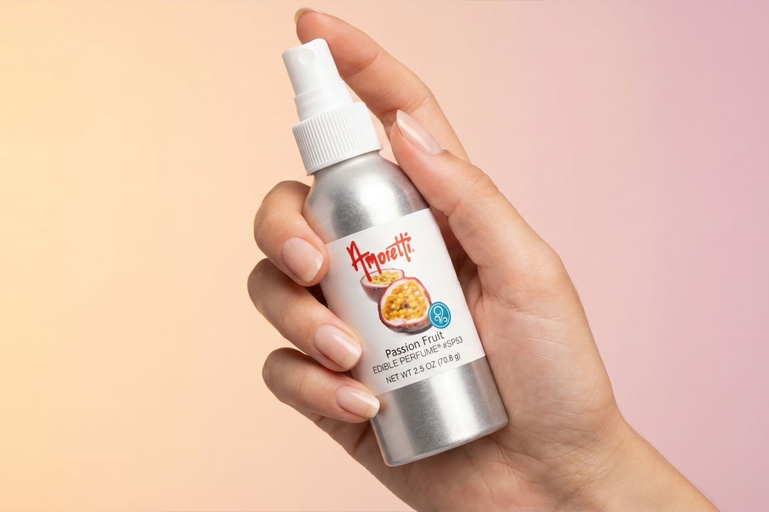 Hand holding a silver spray bottle with a playful label.