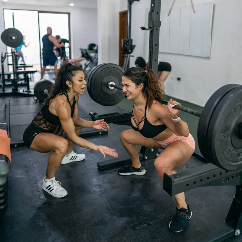 Stephanie Ayala McHugh training a girl in the gym