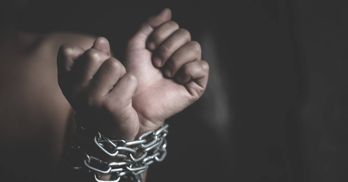 Hands bound in chains