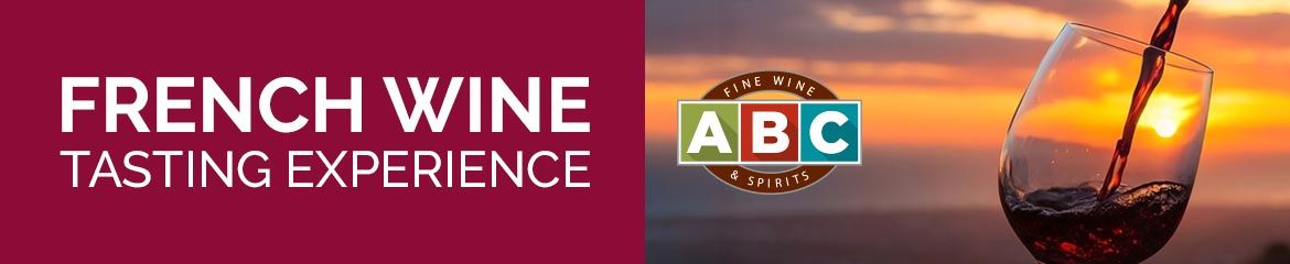 French Wine Tasting Experience with a glass of wine and sunset background.