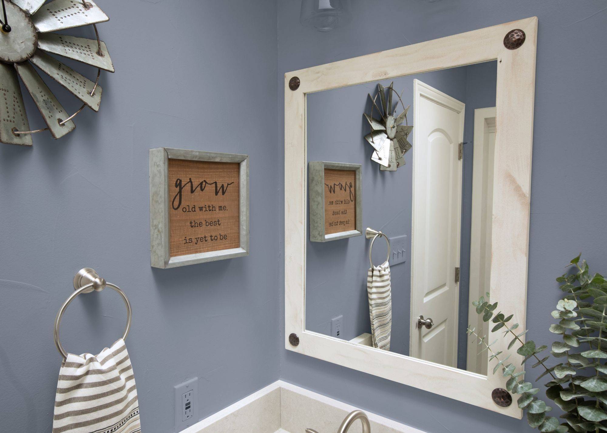 white bathroom vanity mirror with metal accents