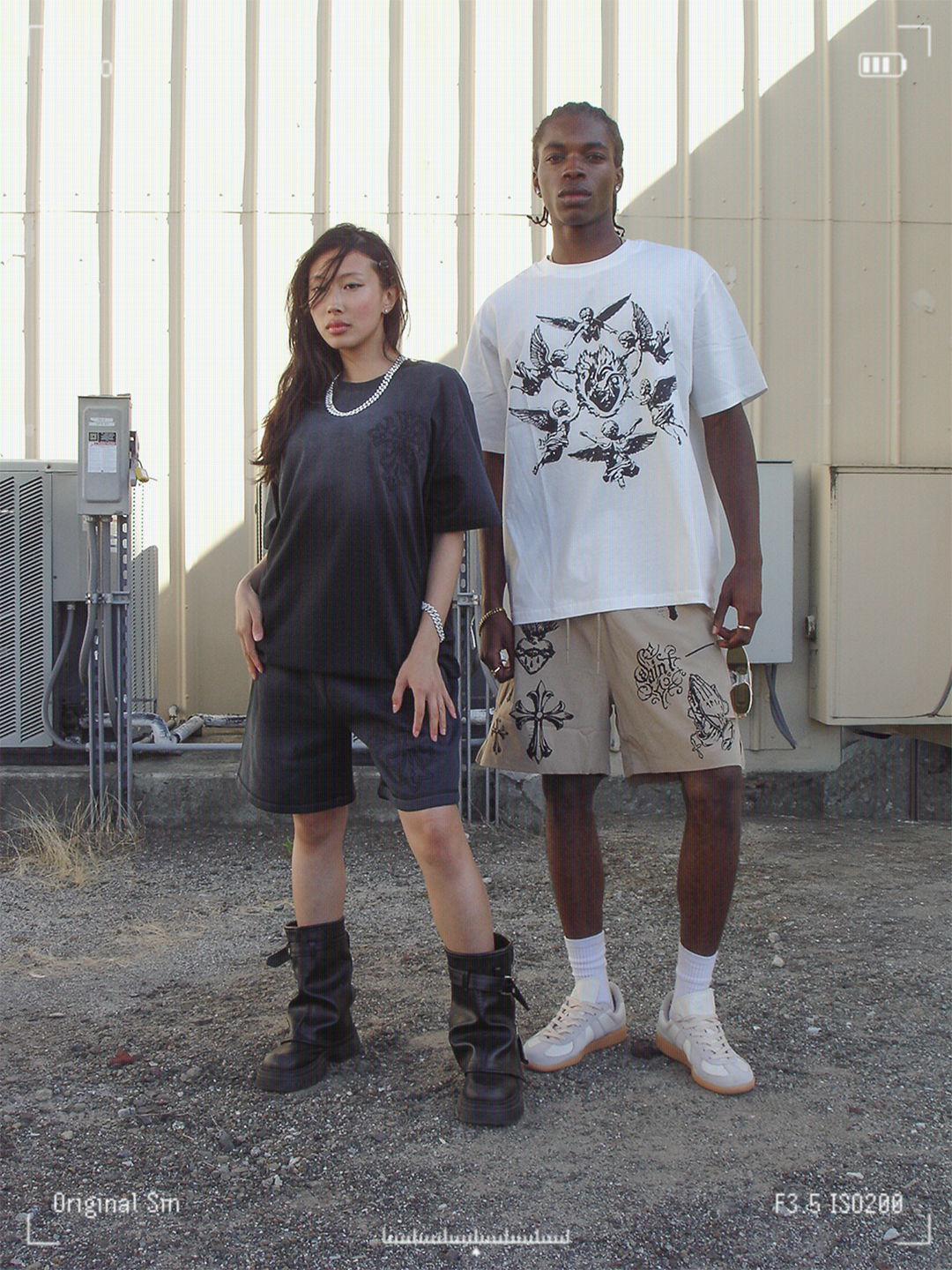 Two models posing outdoors in casual streetwear outfits.