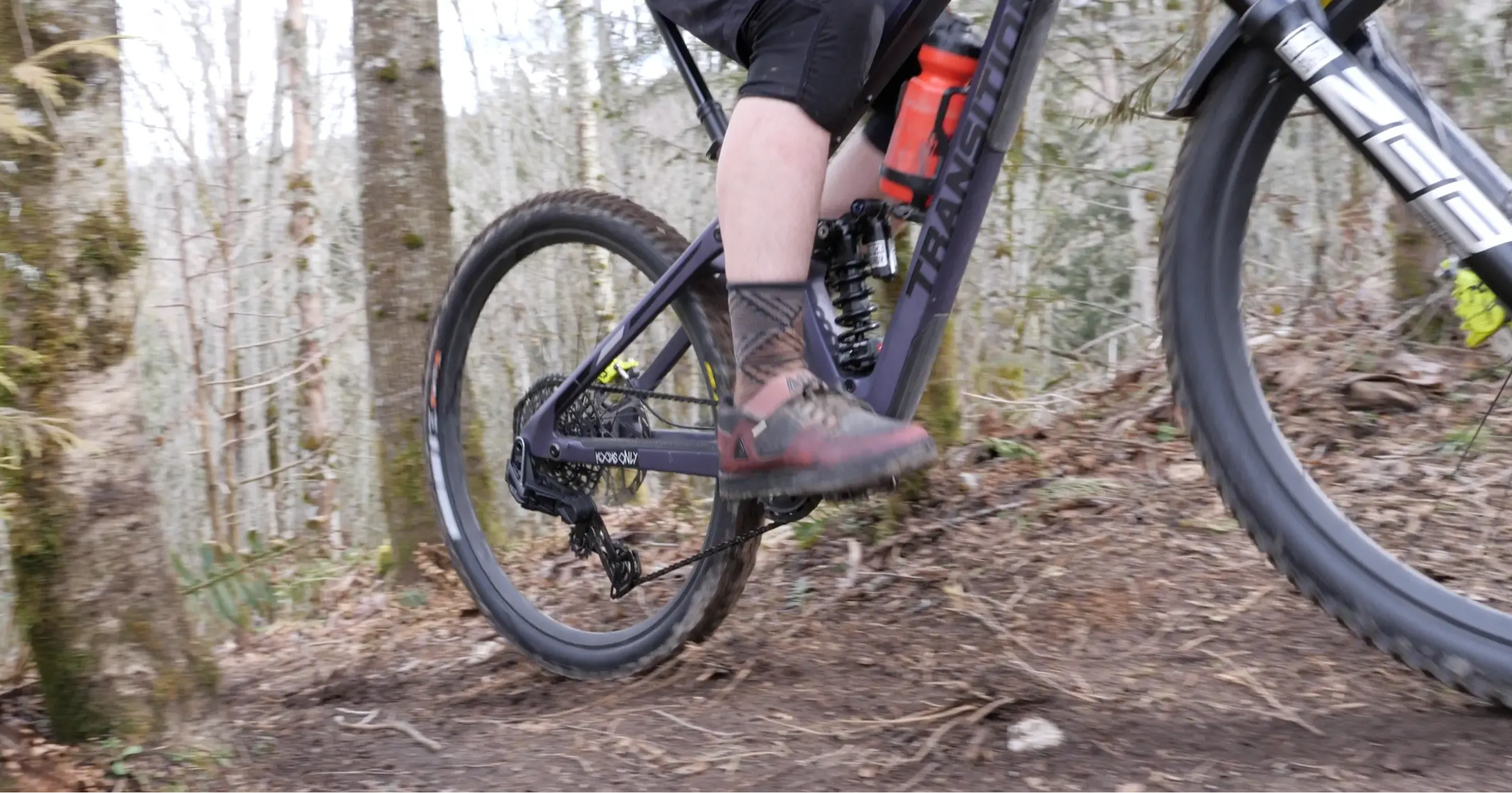 tor climbing roots with a sram x0 axs transmission on his mountain bike 