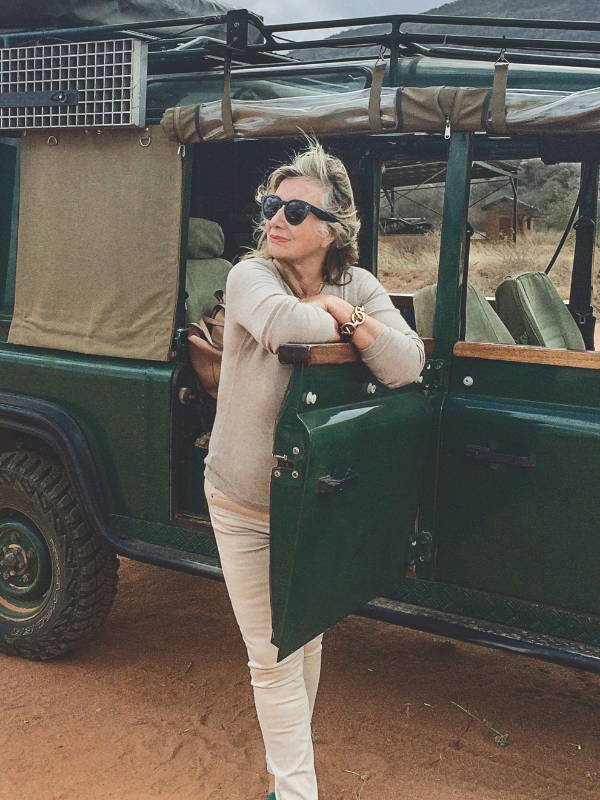 Sylvie Chantecaille in Africa by a jeep
