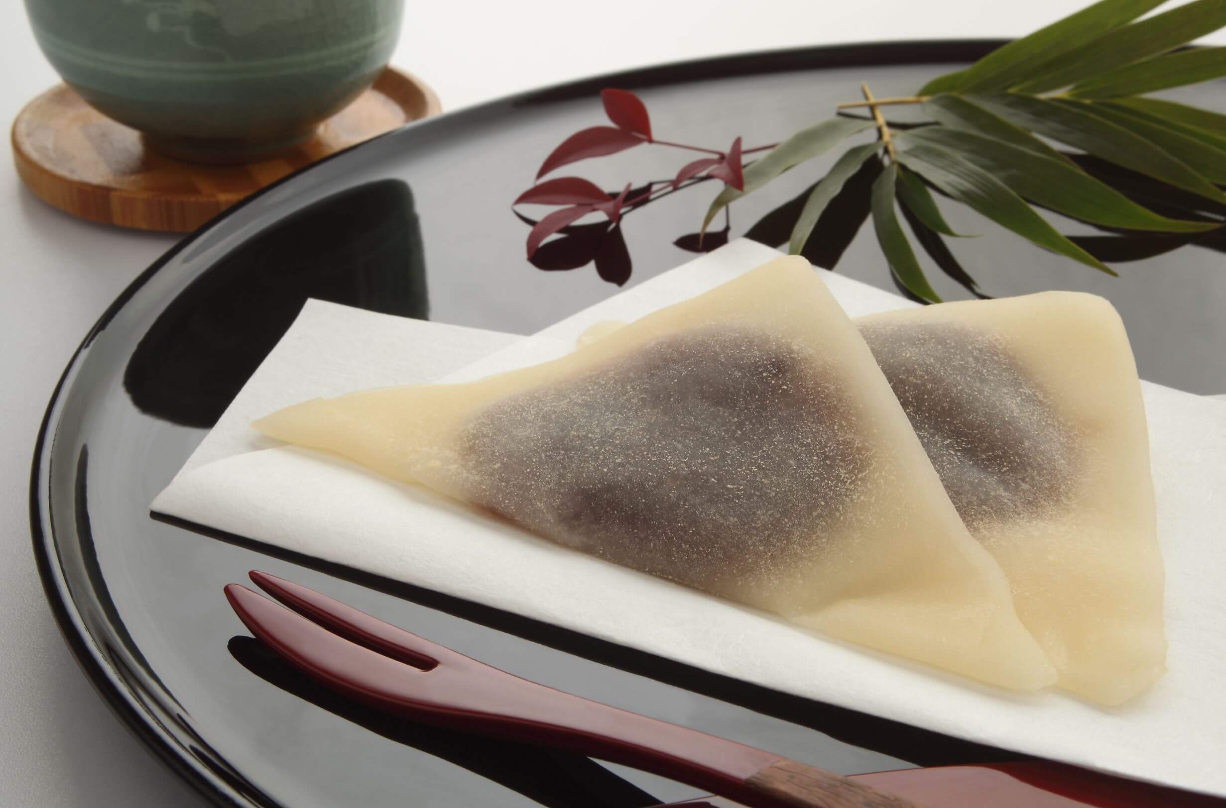 Yatsuhashi, thin mochi folded in half and filled with red bean paste