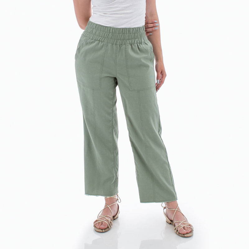 Detail view of Temple pants in light green color.
