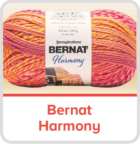 Bernat Harmony yarn in vibrant pink and orange colors.