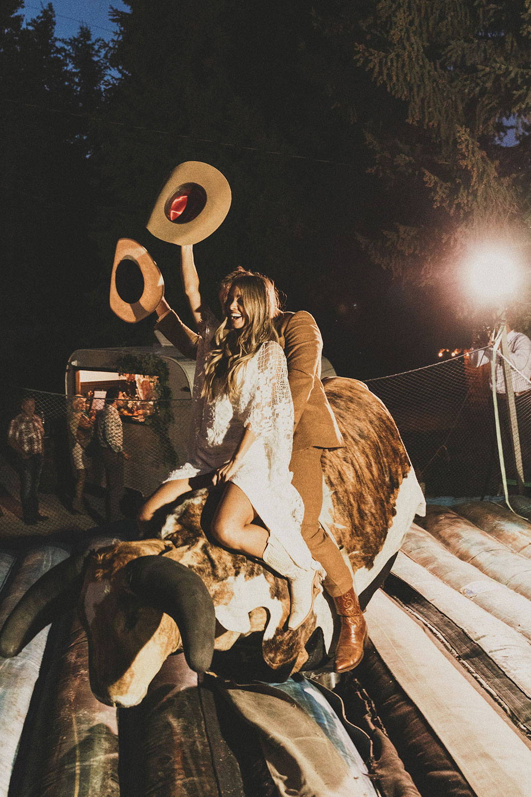 Bride and groom on mechanical bull