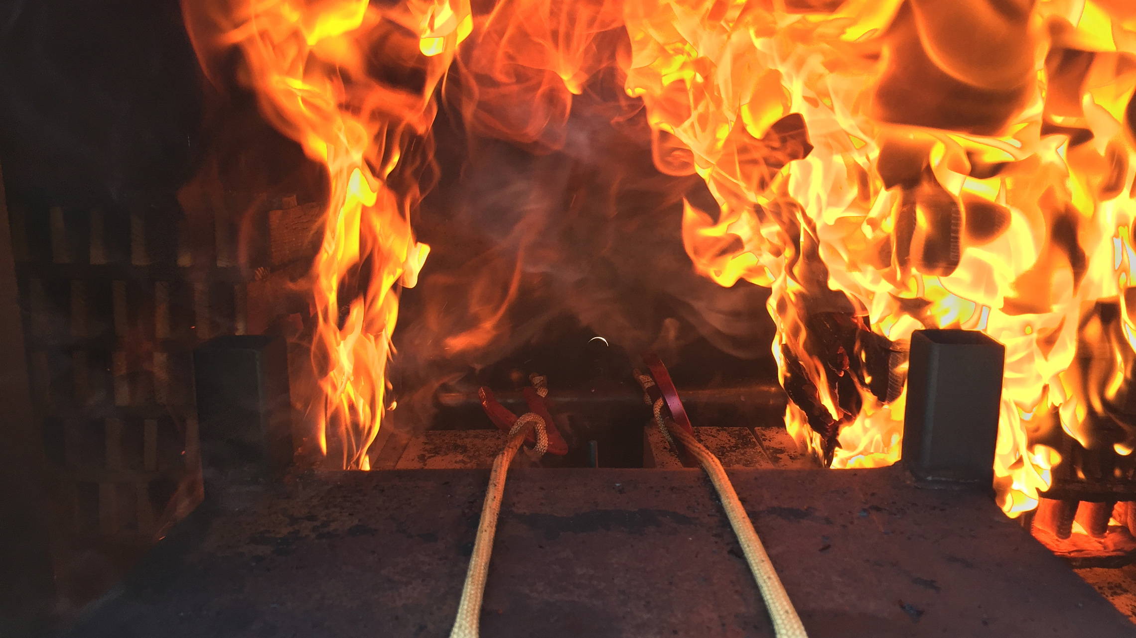 image of Subjecting our anchor hooks and escape ropes to simulated real fire conditions: high heat, rollover, and flashover