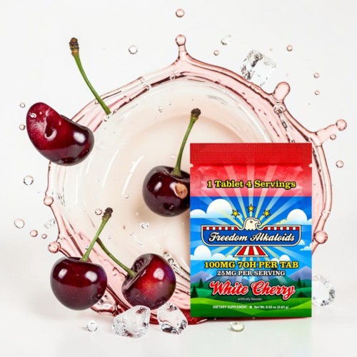 Cherries with splash of water beside a colorful packaging of cherry-flavored product.