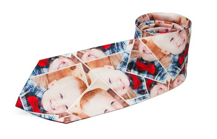 Custom necktie with child's photo scattered across it 