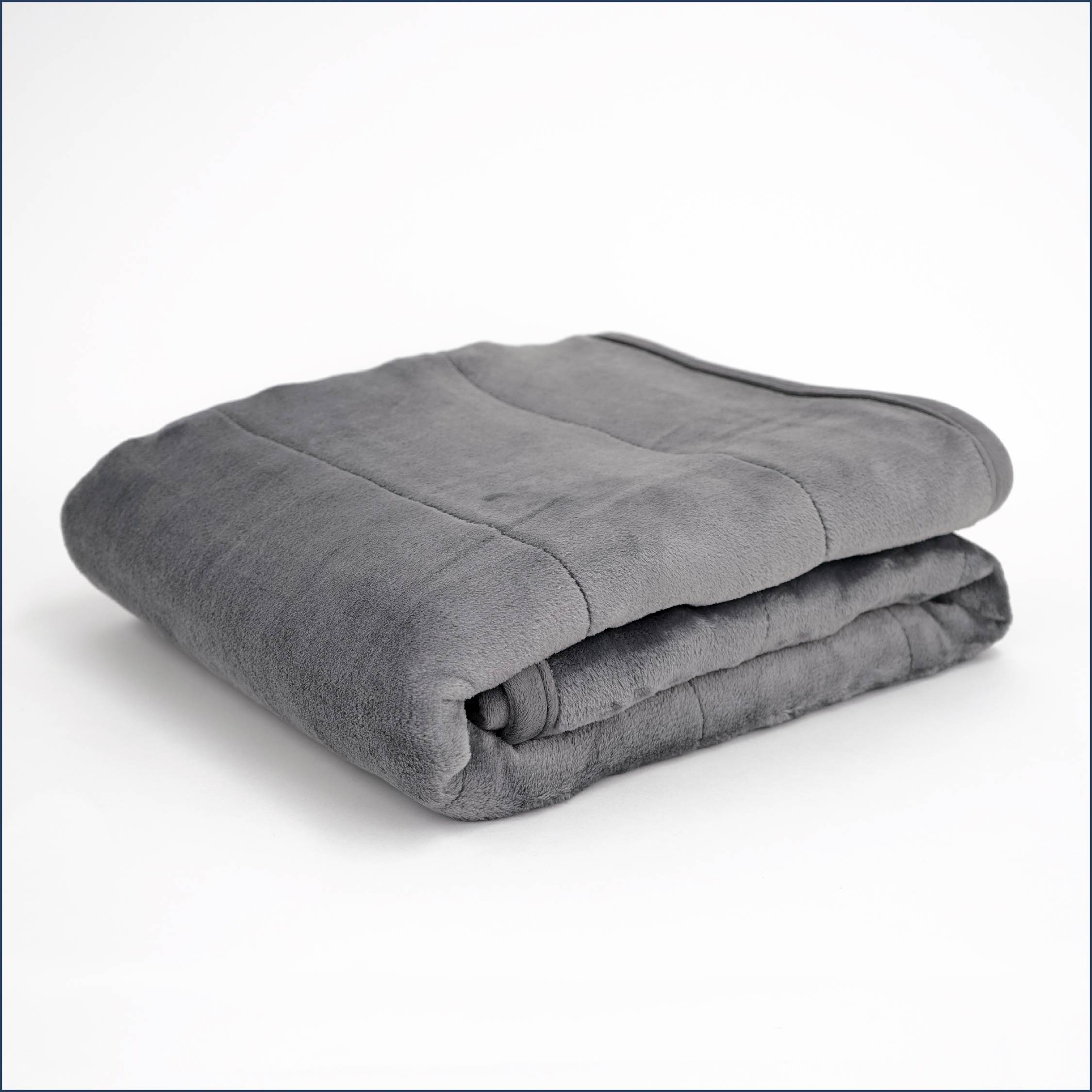 Tuc Warm Weighted Blanket folded on white background.