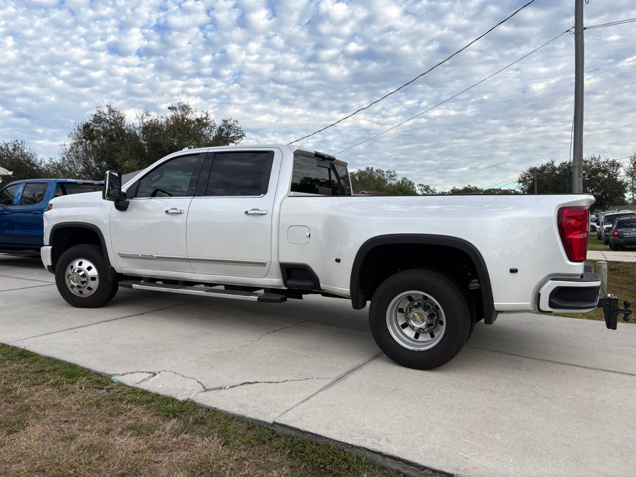 Exterior three-quarter view of Shawn's 2025 Chevy Silverado 3500HD High Country dually with HornBlasters Stealth 5 Gallon Spare Tire Delete kit featured customer install gallery photo 1