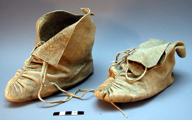 Two pairs of vintage leather shoes, one larger and one smaller.