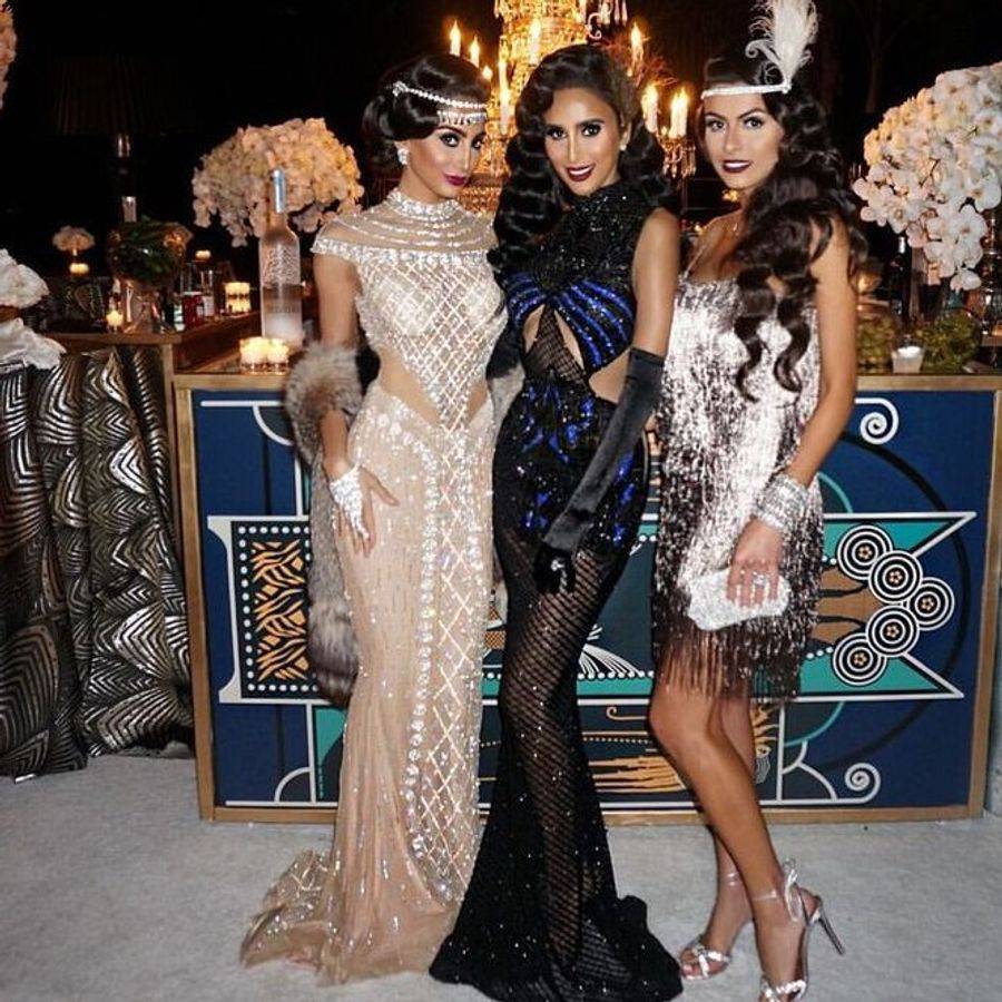 Image of three women dressed in 1920s themed costumes.
