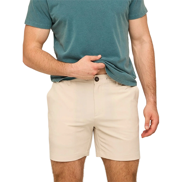 Man in a teal shirt and beige shorts.