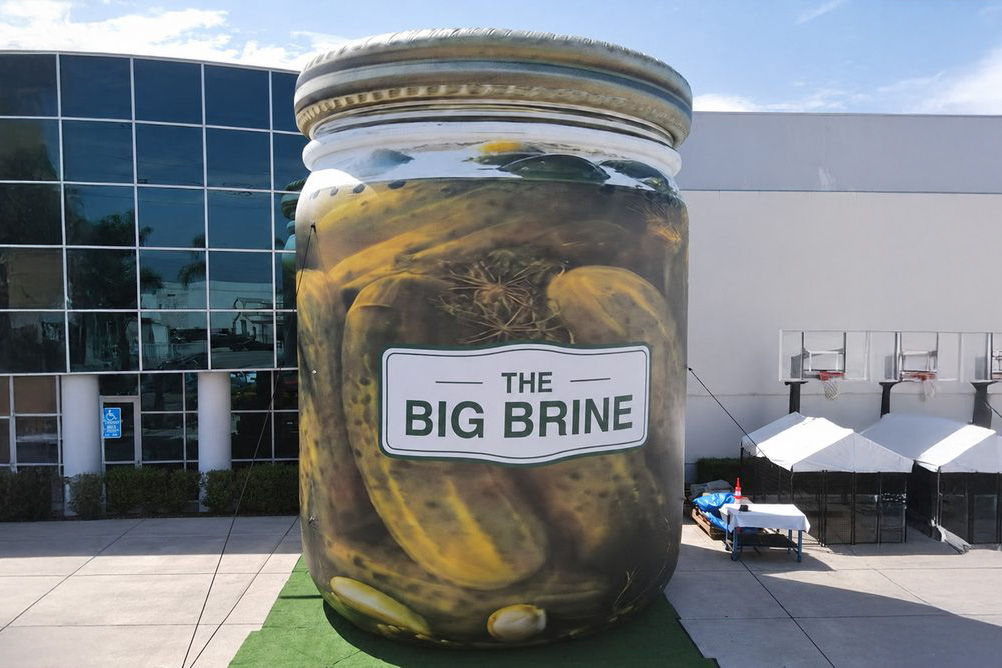 Giant jar of pickles labeled 