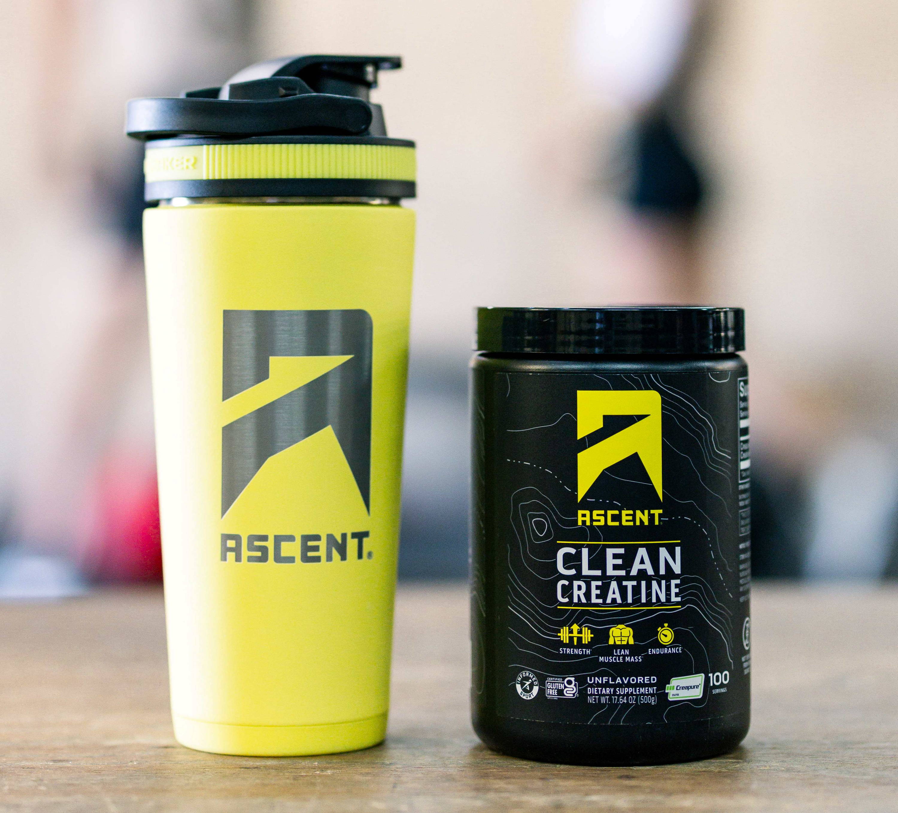 an Ascent shaker bottle next to a container of Ascent Clean Creatine