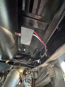 Air tank and control box with wiring installed on the undercarriage of Noah's Ford F250