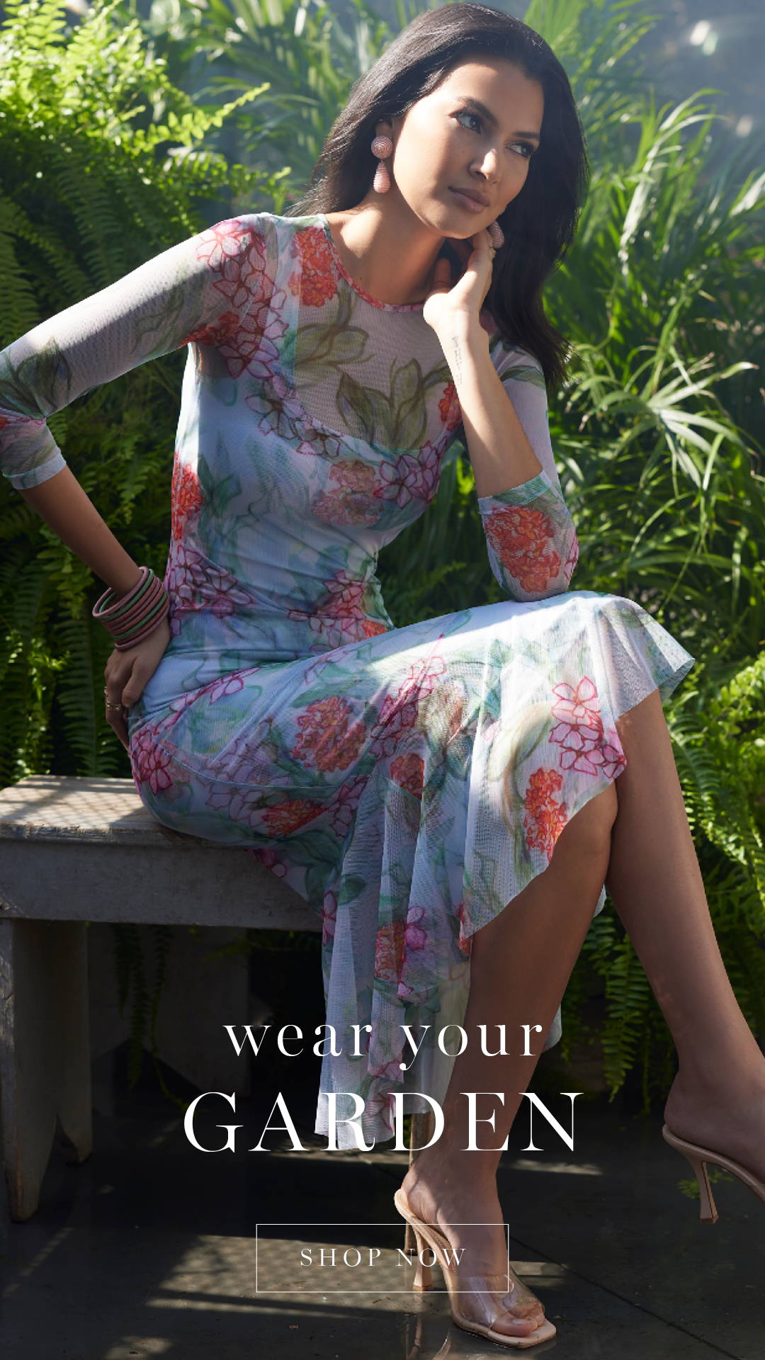 WEAR YOUR GARDEN | SHOP NOW | Woman wearing floral stretch knit short cocktail dress with mesh topper over it 