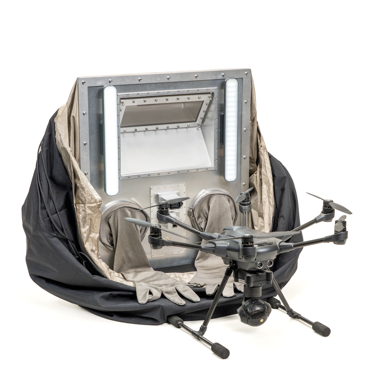 Drone with lighting setup inside a carrying case.